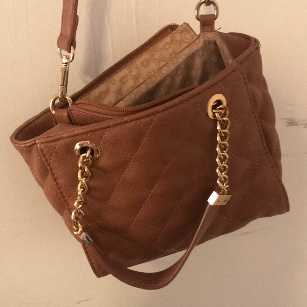 Brown cross body purse with gold accents